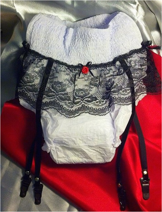 gag gift adult diaper with lace garter straps over the