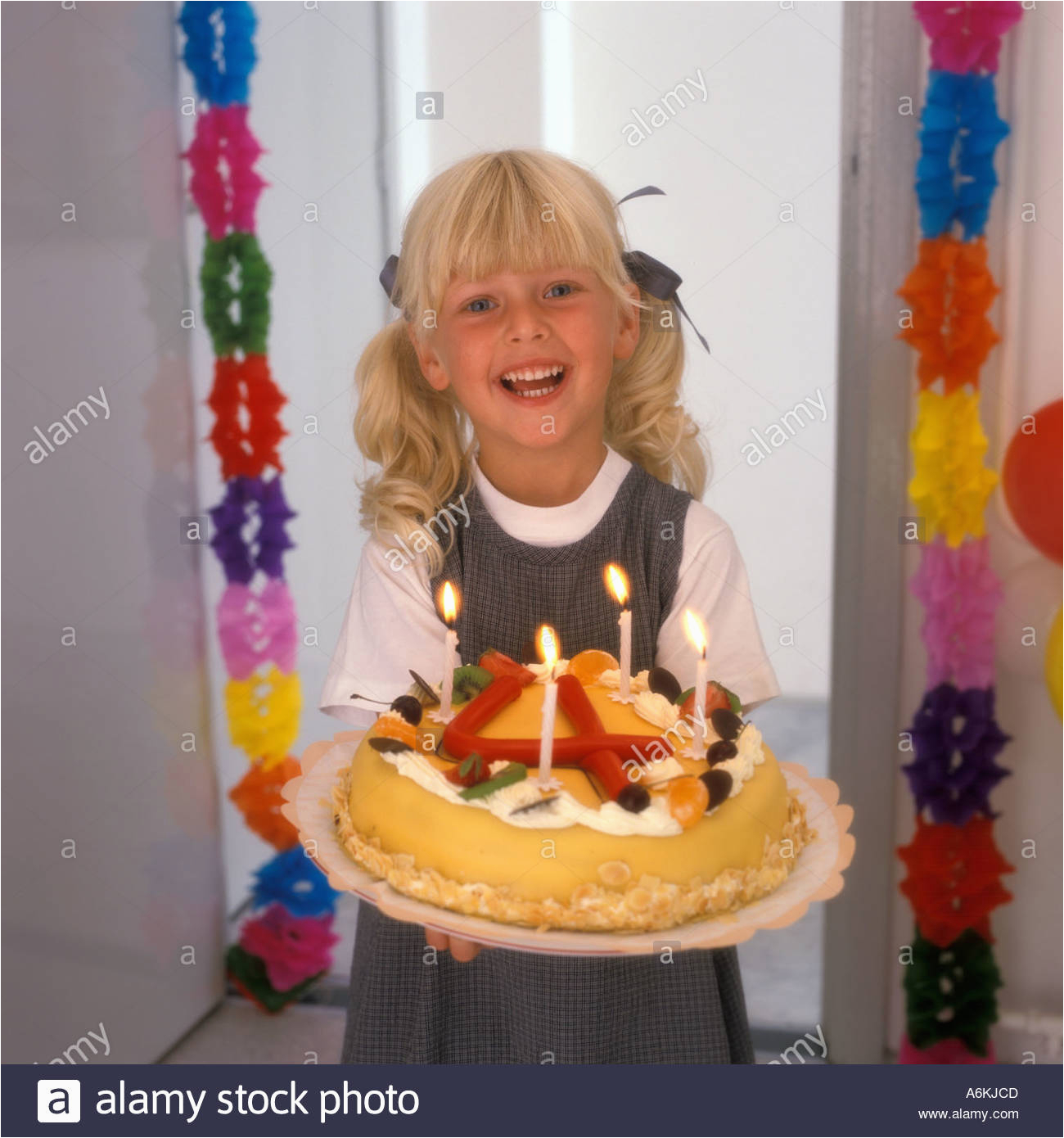 stock photo 4 year old girl with a birthday cake 3786444